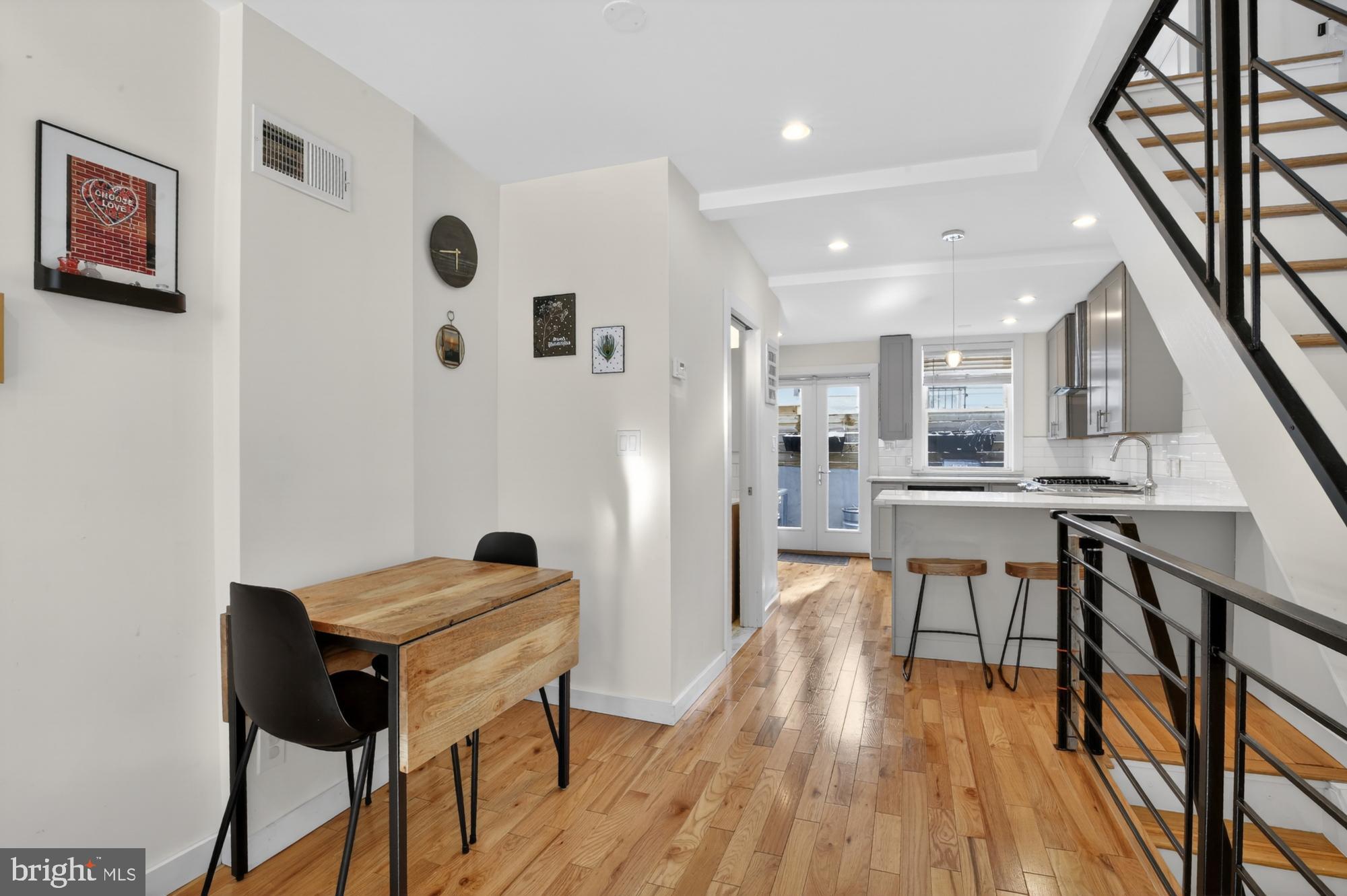 741 Watkins Street Philadelphia, PA 19148 - Photo 4 of 25 a view of a dining room with furniture and wooden floor