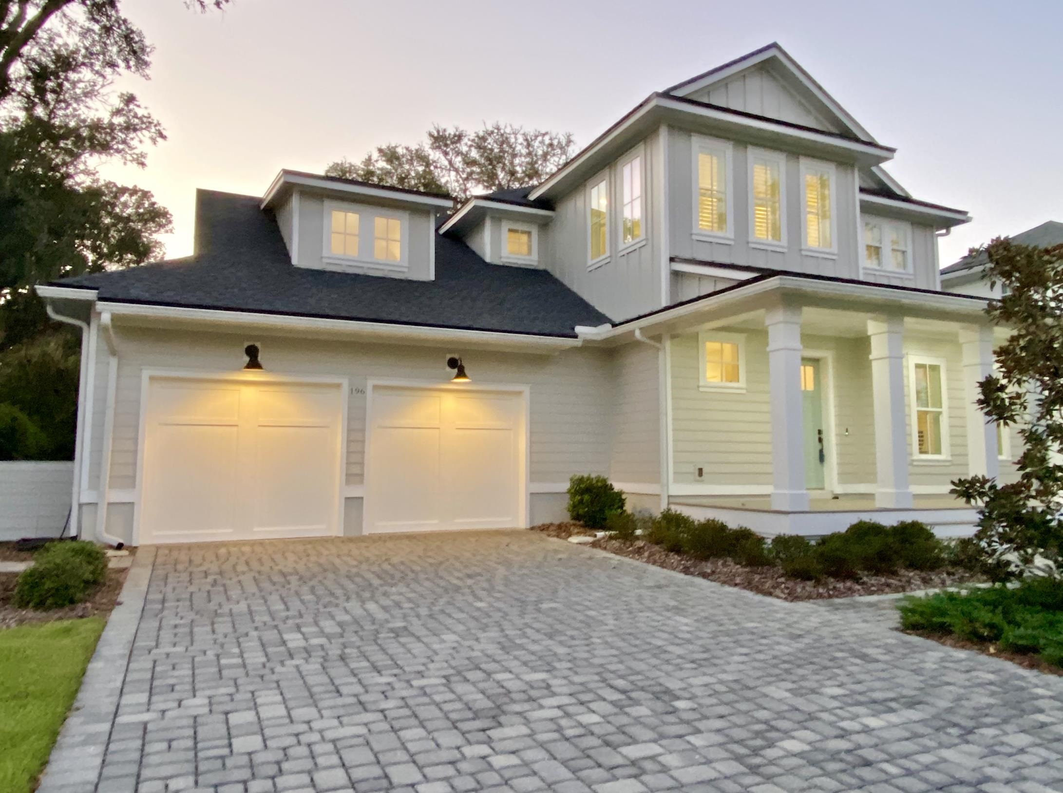 196 Ridgeway Road St. Augustine, FL 32080 - Photo 54 of 63 a front view of a house with a yard and garage
