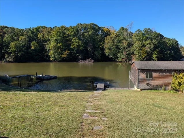 a view of a swimming pool with an outdoor space and seating area