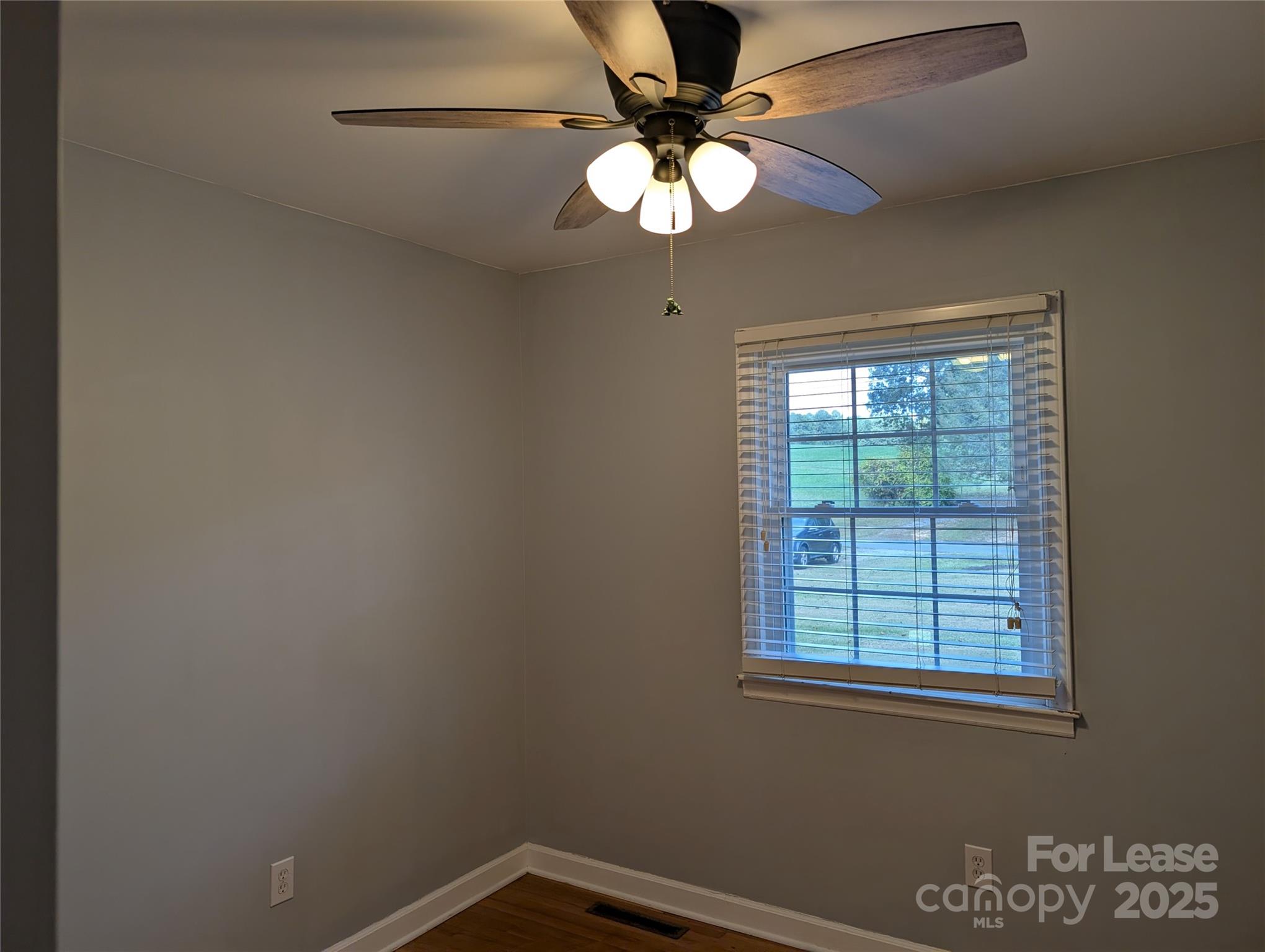 155 Hamptons Cove Road Troutman, NC 28166 - Photo 11 of 22 an empty room with a window