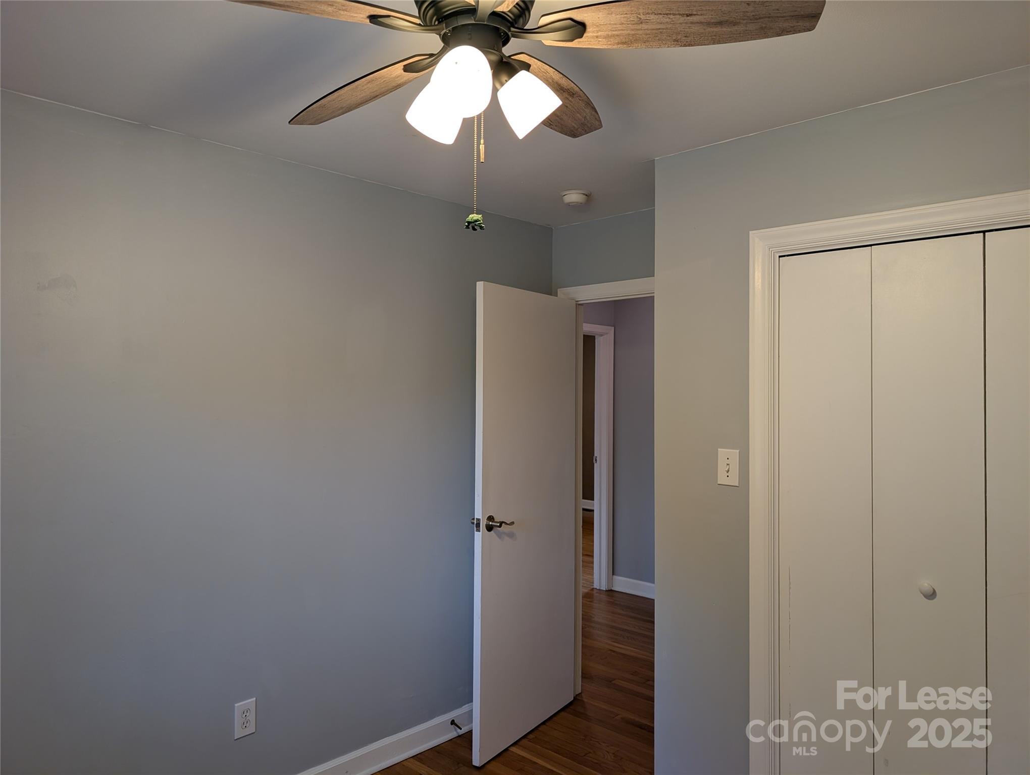 155 Hamptons Cove Road Troutman, NC 28166 - Photo 12 of 22 a view of a chandelier fan and closet area