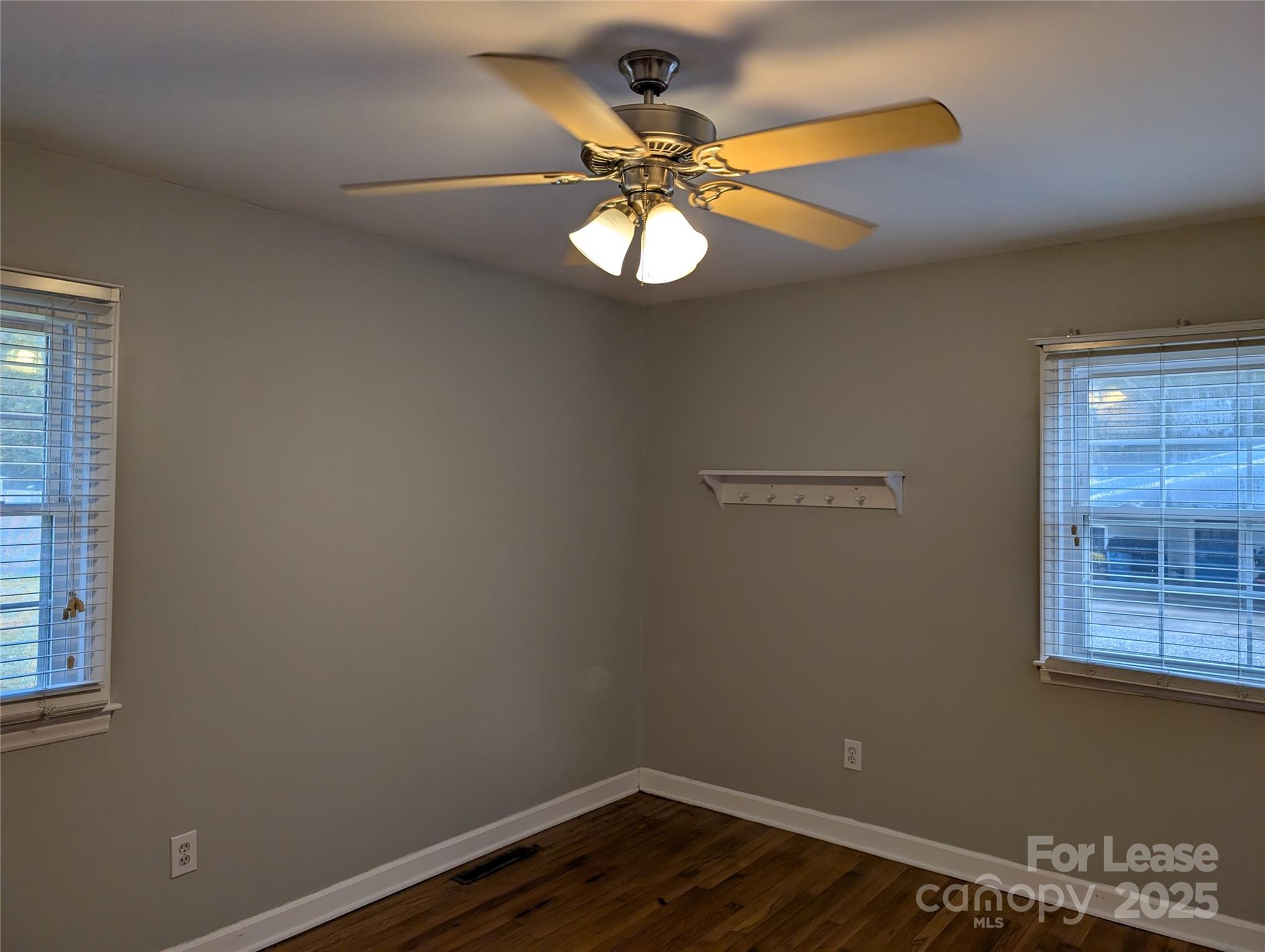 155 Hamptons Cove Road Troutman, NC 28166 - Photo 13 of 22 a view of a workspace with wooden floor