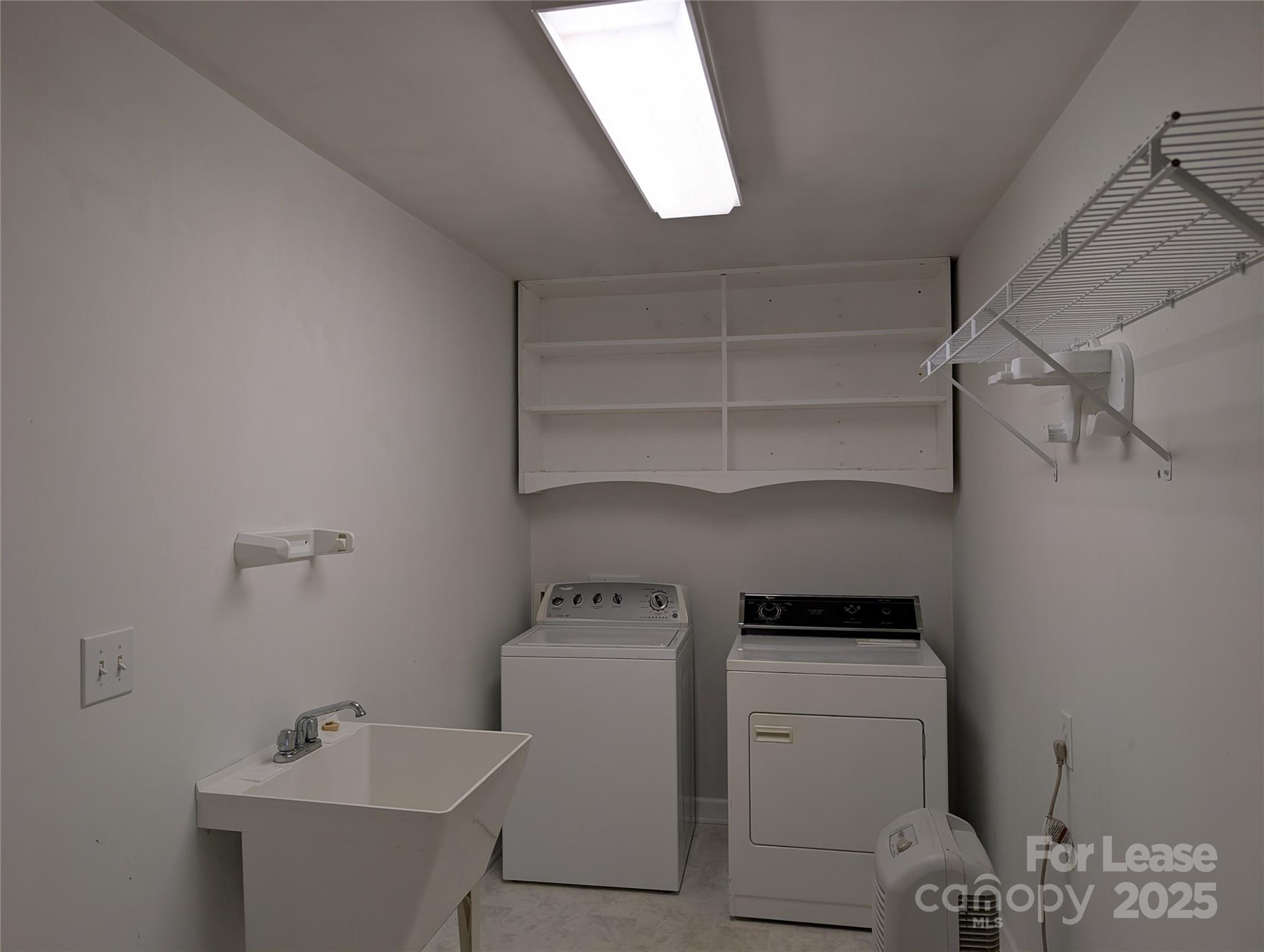 155 Hamptons Cove Road Troutman, NC 28166 - Photo 19 of 22 a utility room with dryer and washer