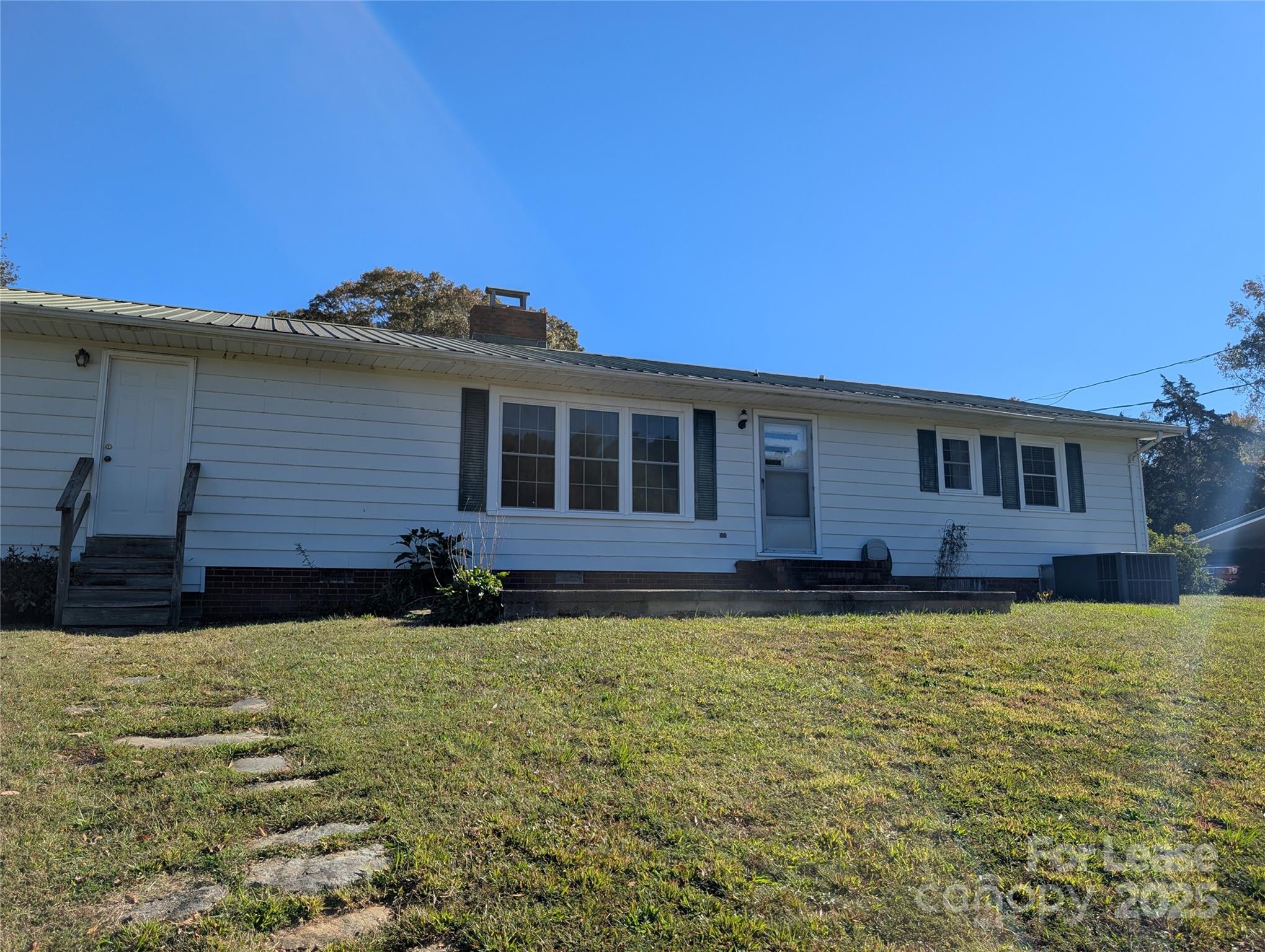 155 Hamptons Cove Road Troutman, NC 28166 - Photo 21 of 22 a view of a house with a backyard