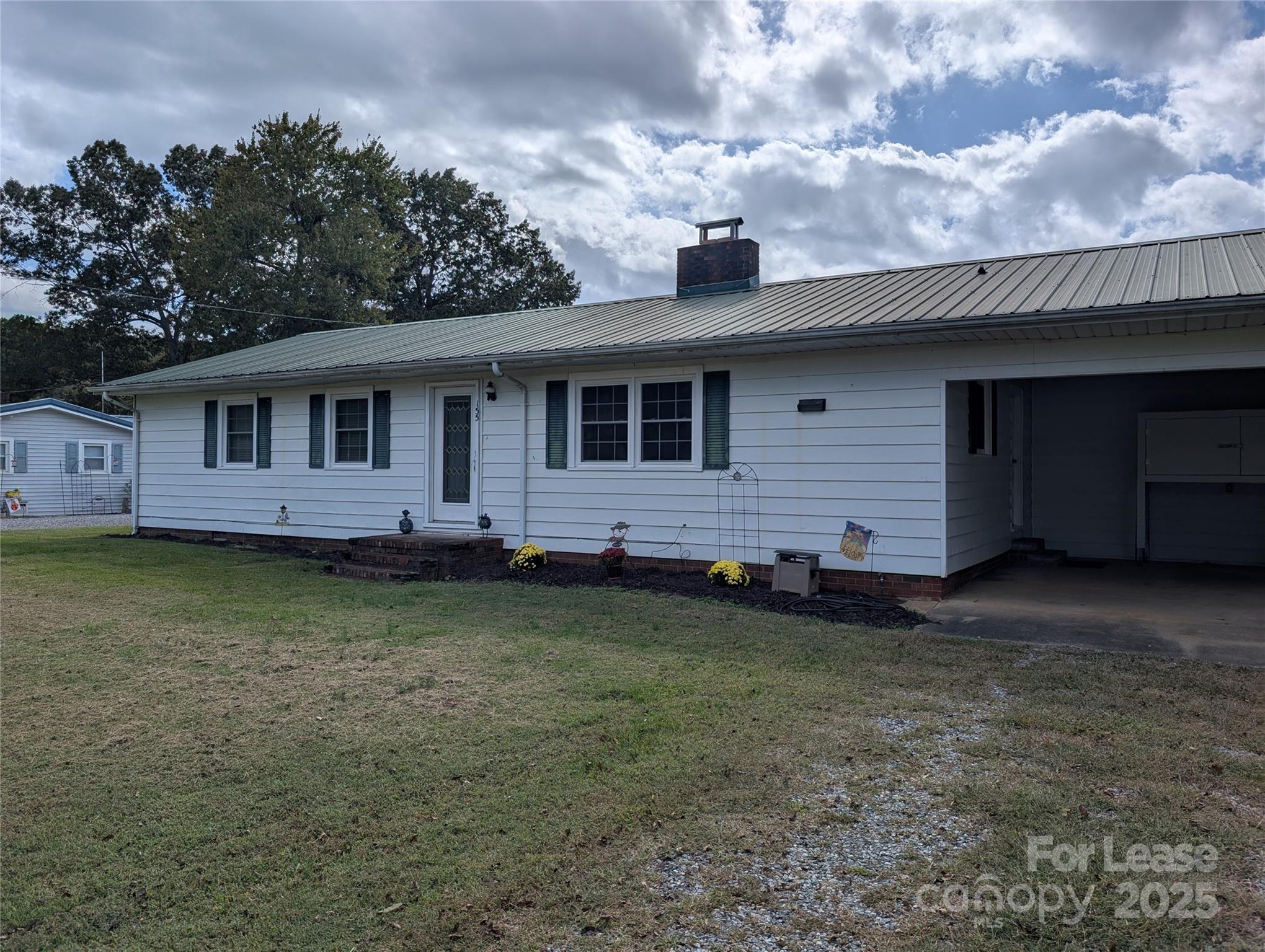 155 Hamptons Cove Road Troutman, NC 28166 - Photo 4 of 22 a view of a house with a backyard
