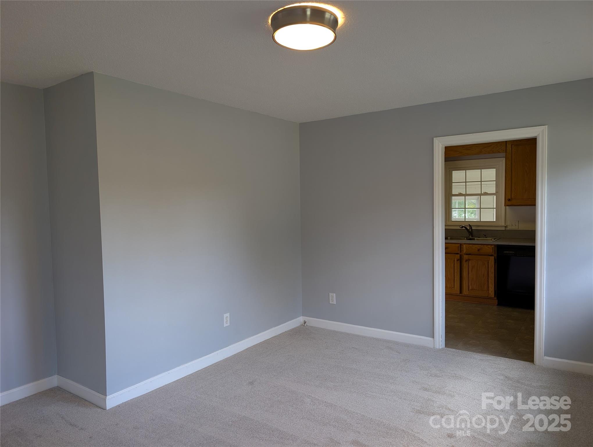 155 Hamptons Cove Road Troutman, NC 28166 - Photo 5 of 22 an empty room with closet