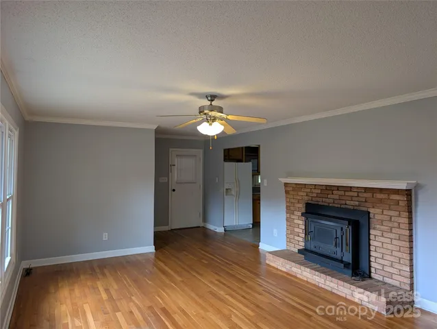 a kitchen with a sink stove top oven and cabinets