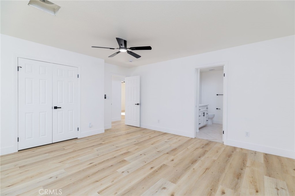 51621 Riza Avenue Cabazon, CA 92230 - Photo 18 of 32 a view of empty room with wooden floor
