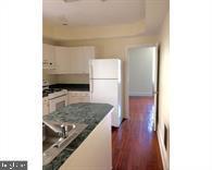 209 Sumac Street Philadelphia, PA 19128 - Photo 7 of 10 a view of a kitchen from the hallway