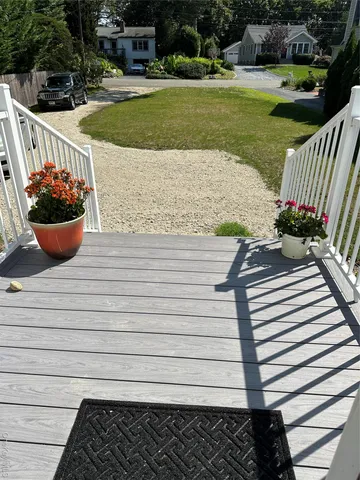 a view of a balcony with chairs