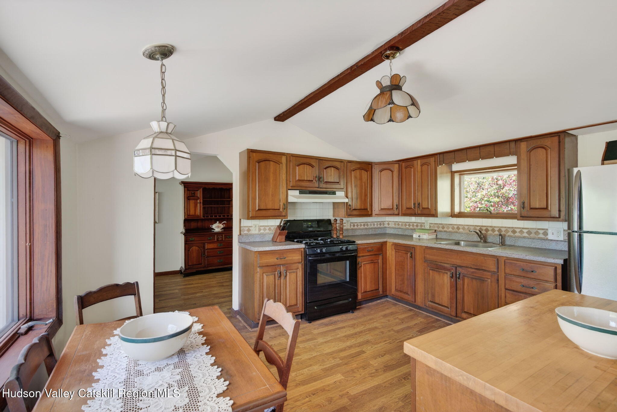 689 Old Road Windham, NY 12496 - Photo 7 of 42 a kitchen with stainless steel appliances granite countertop a sink a stove and a wooden floors