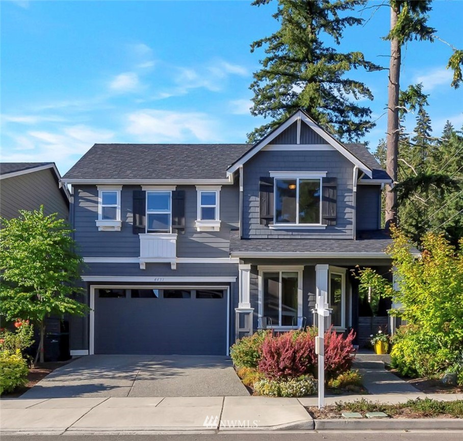 a front view of a house with yard