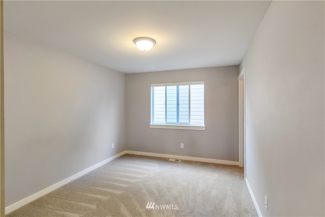 4431 225th Place Southeast Bothell, WA 98021 - Photo 11 of 19 an empty room with a window
