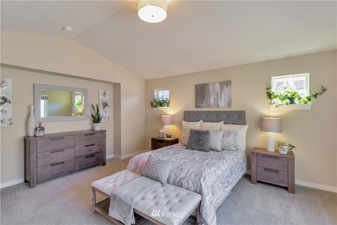 4431 225th Place Southeast Bothell, WA 98021 - Photo 13 of 19 a bedroom with a bed and a dresser