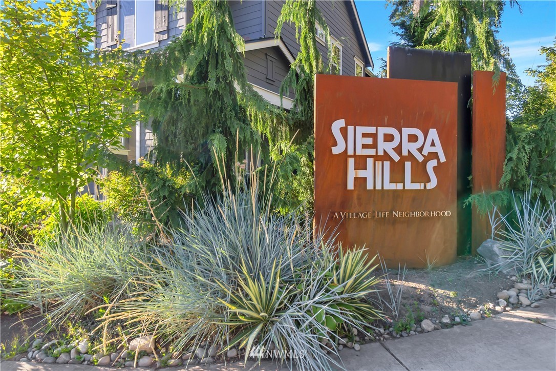 4431 225th Place Southeast Bothell, WA 98021 - Photo 15 of 19 a sign that is on a brick wall