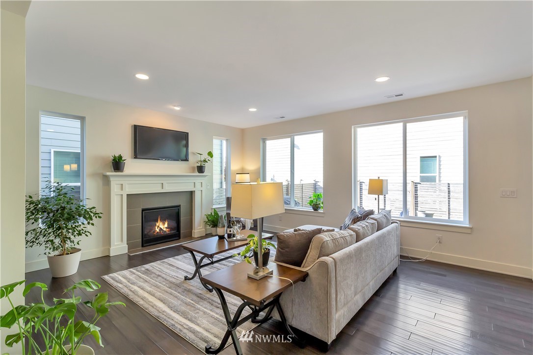 4431 225th Place Southeast Bothell, WA 98021 - Photo 3 of 19 a living room with furniture and a fireplace