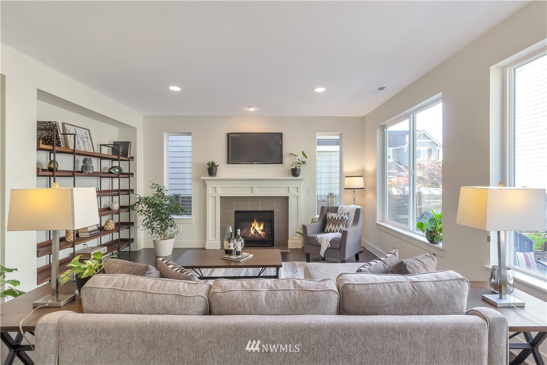 4431 225th Place Southeast Bothell, WA 98021 - Photo 4 of 19 a living room with furniture and a fireplace