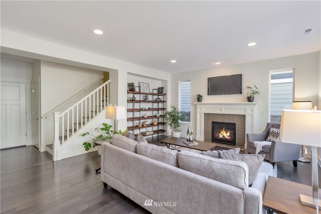 4431 225th Place Southeast Bothell, WA 98021 - Photo 5 of 19 a living room with furniture and a fireplace