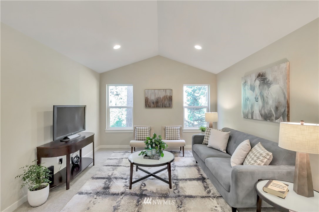 4431 225th Place Southeast Bothell, WA 98021 - Photo 8 of 19 a living room with furniture and a flat screen tv