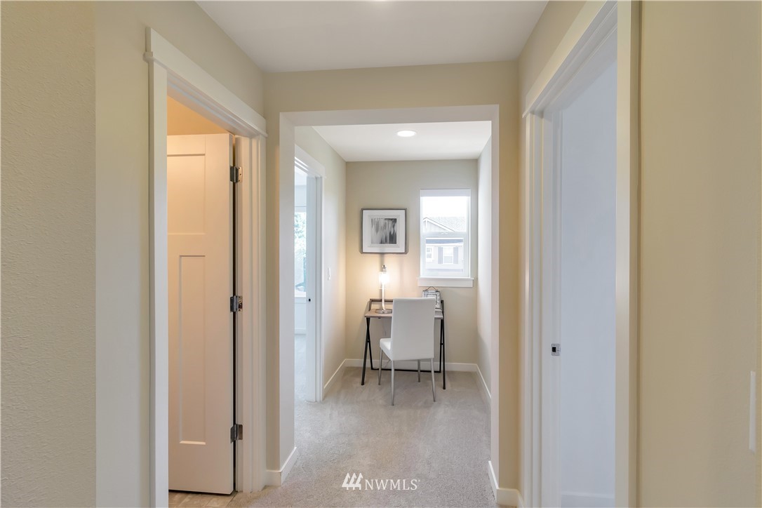 4431 225th Place Southeast Bothell, WA 98021 - Photo 9 of 19 a view of a hallway with bathroom and a bathroom