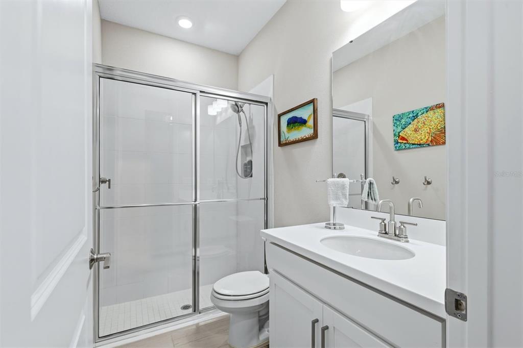 9268 Tequila Sunrise Drive Sarasota, FL 34241 - Photo 25 of 56 a bathroom with a sink toilet and shower