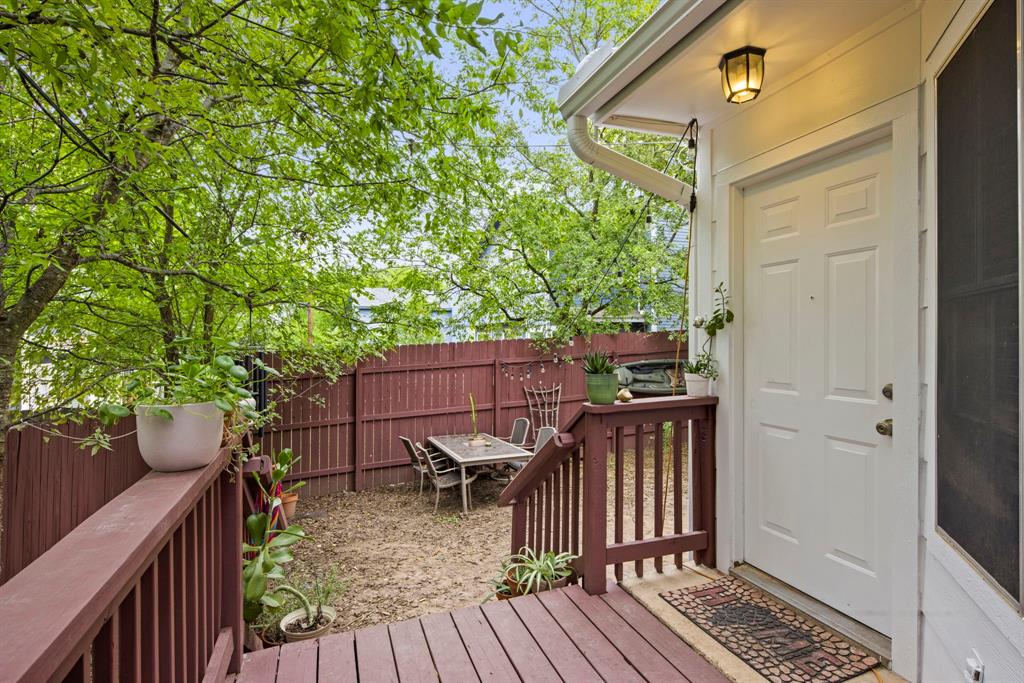2102 Kenneth Avenue, Unit A Austin, TX 78741 - Photo 13 of 15 Private outdoor deck with rich wood-finish flooring and matching railings