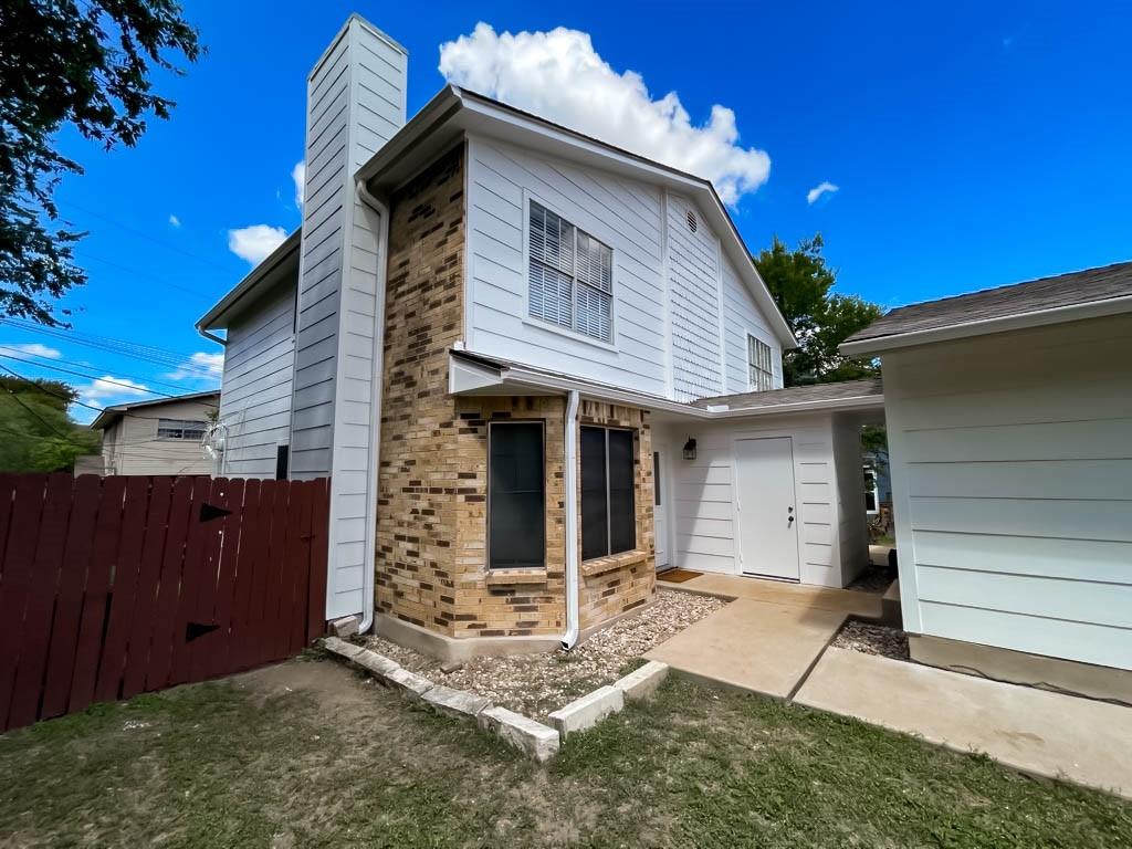 2102 Kenneth Avenue, Unit A Austin, TX 78741 - Photo 3 of 15 Two-story residence featuring white siding and a brick facade