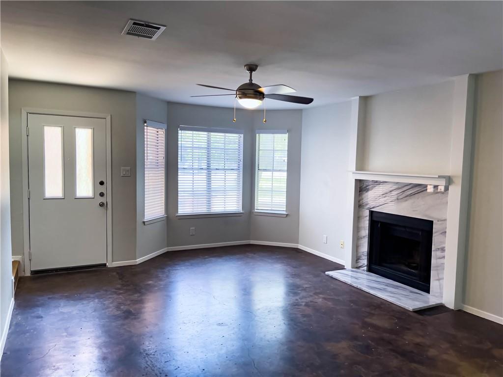 2102 Kenneth Avenue, Unit A Austin, TX 78741 - Photo 5 of 15 Spacious interior with dark-toned flooring