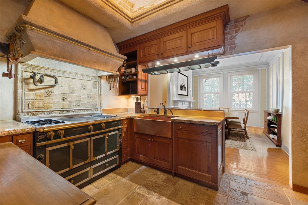 357-359 Beacon Street, Unit 2 Boston, MA 02116 - Photo 4 of 18 a kitchen with wooden cabinets and a stove top oven