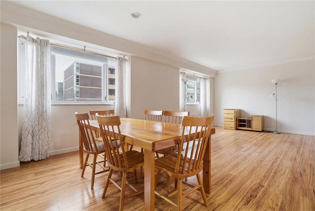 128 North Craig Street, Unit 511 Pittsburgh, PA 15213 - Photo 12 of 46 a view of a dining room with furniture and wooden floor