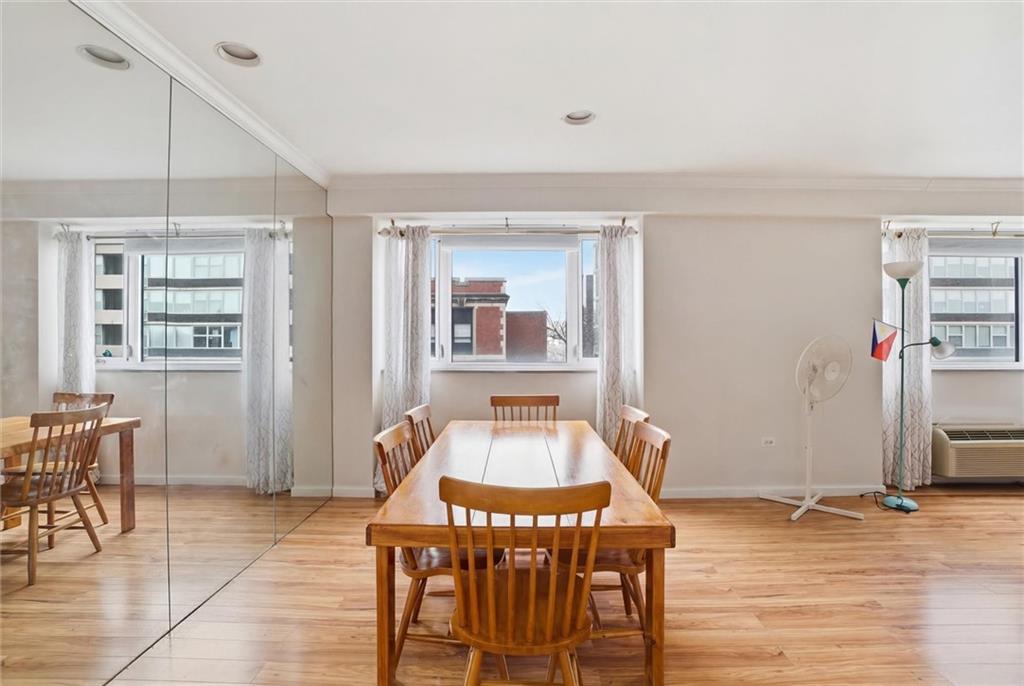 128 North Craig Street, Unit 511 Pittsburgh, PA 15213 - Photo 15 of 46 a dining room with furniture and wooden floor