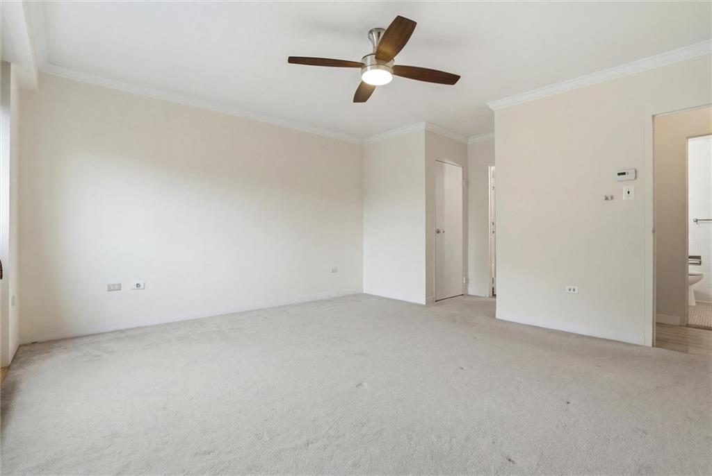 128 North Craig Street, Unit 511 Pittsburgh, PA 15213 - Photo 26 of 46 an empty room with a ceiling fan and window