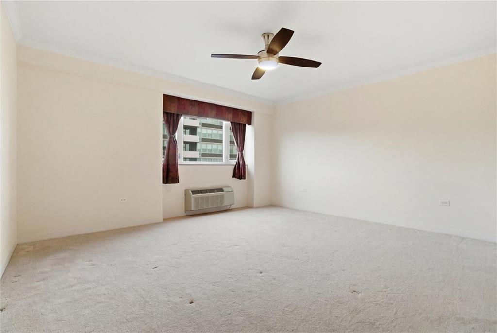 128 North Craig Street, Unit 511 Pittsburgh, PA 15213 - Photo 28 of 46 an empty room with a ceiling fan and window