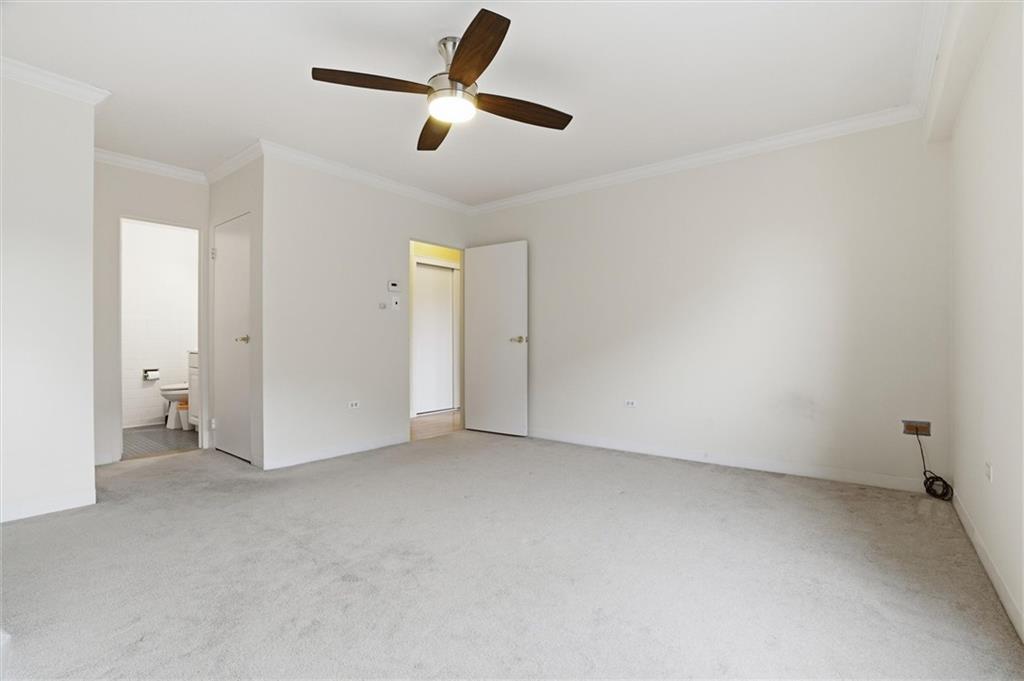 128 North Craig Street, Unit 511 Pittsburgh, PA 15213 - Photo 29 of 46 an empty room with ceiling fan and window
