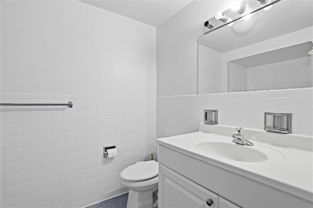 128 North Craig Street, Unit 511 Pittsburgh, PA 15213 - Photo 30 of 46 a bathroom with a sink toilet and a mirror