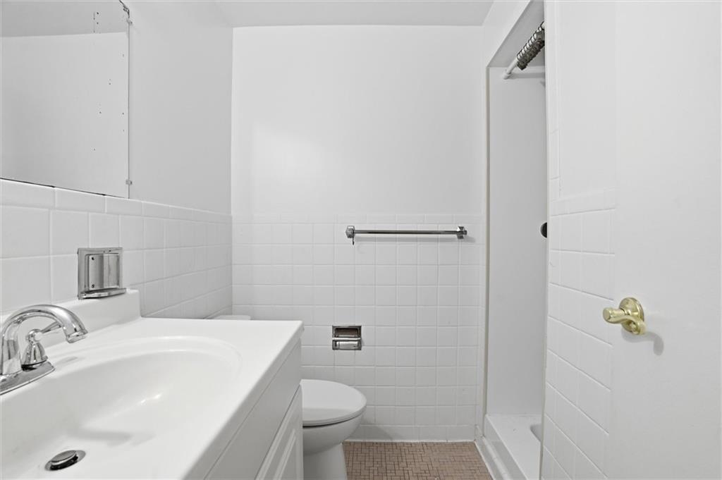 128 North Craig Street, Unit 511 Pittsburgh, PA 15213 - Photo 32 of 46 a bathroom with a sink toilet and shower