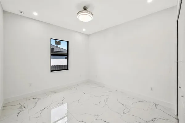an empty room with a empty space and window