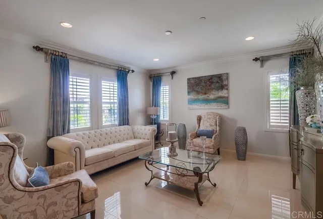 a living room with furniture and a large window