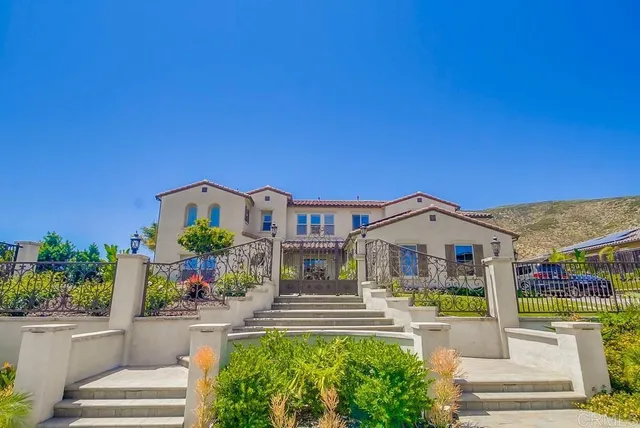 a front view of house with an outdoor space and seating area