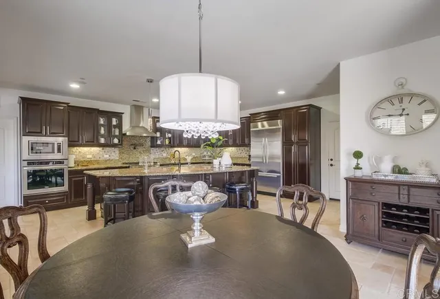 a kitchen with a table and chairs in it
