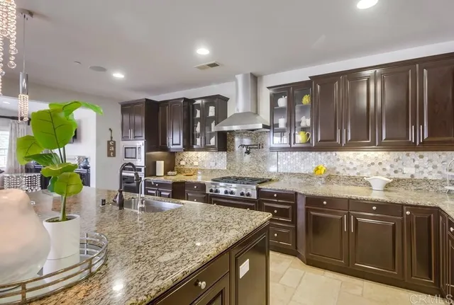 a kitchen with sink and cabinets