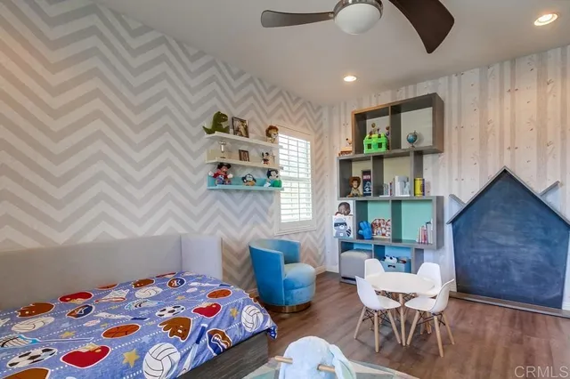 a bedroom with a bed and a table