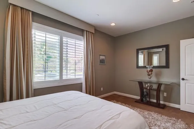 a view of house with swimming pool outdoor seating