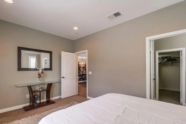 a view of a house with swimming pool and sitting area