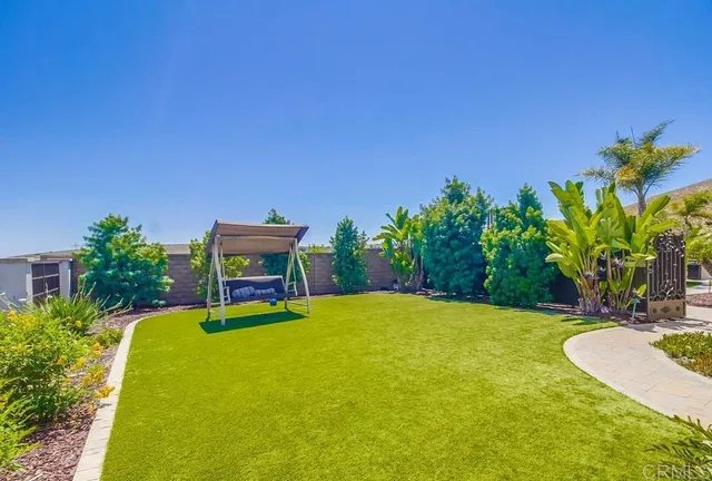 a view of a swimming pool with an outdoor seating