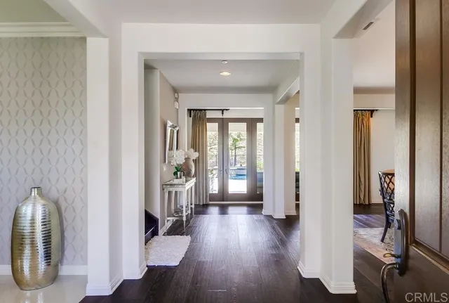 a view of entryway with livingroom and wooden floor