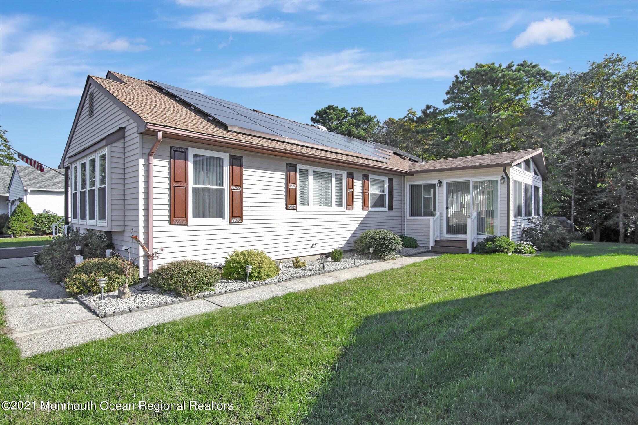 17 Ashley Road Whiting, NJ 08759 - Photo 2 of 31 a view of a house with a backyard and a porch