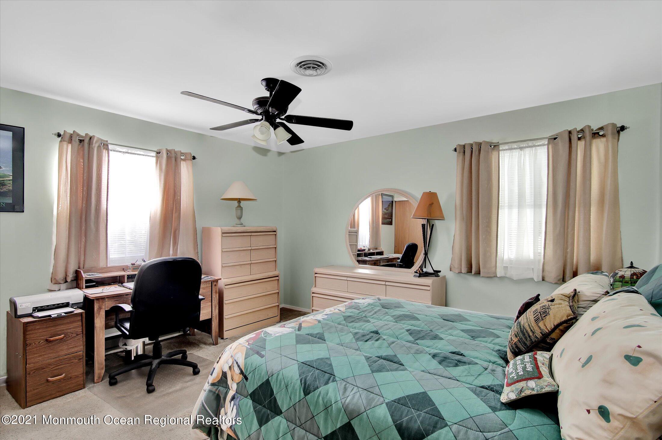 17 Ashley Road Whiting, NJ 08759 - Photo 20 of 31 a bedroom with a bed and a large window