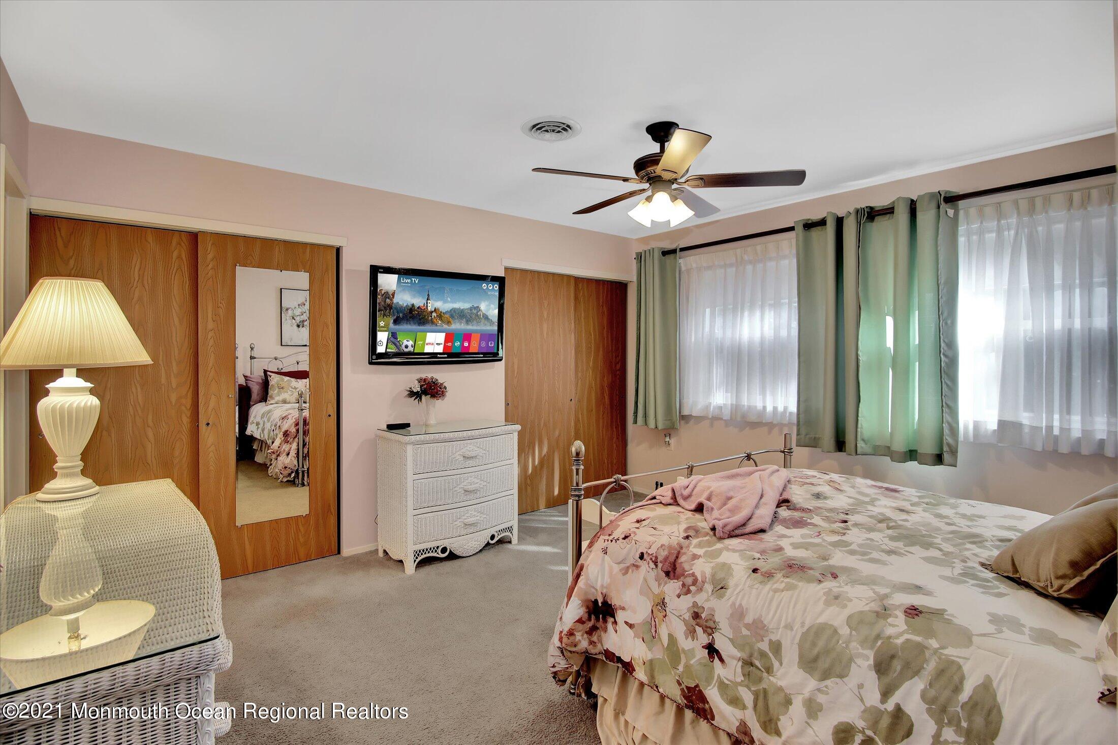 17 Ashley Road Whiting, NJ 08759 - Photo 21 of 31 a bedroom with a bed and ceiling fan