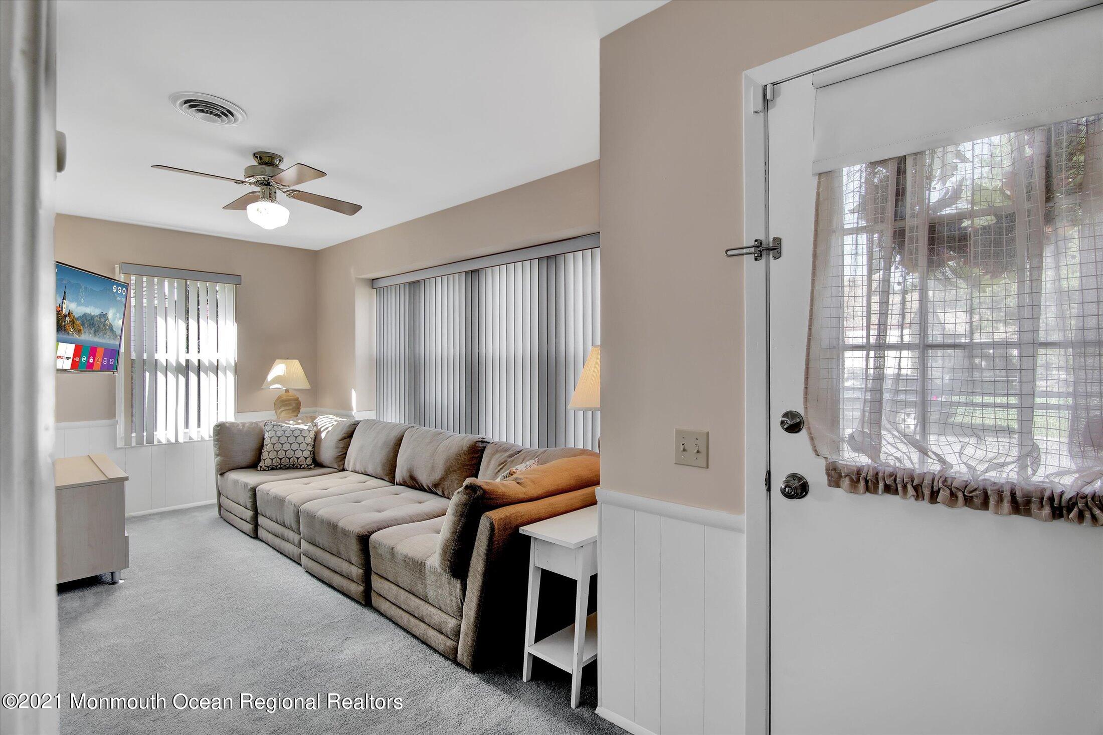 17 Ashley Road Whiting, NJ 08759 - Photo 4 of 31 a living room with furniture and a chandelier